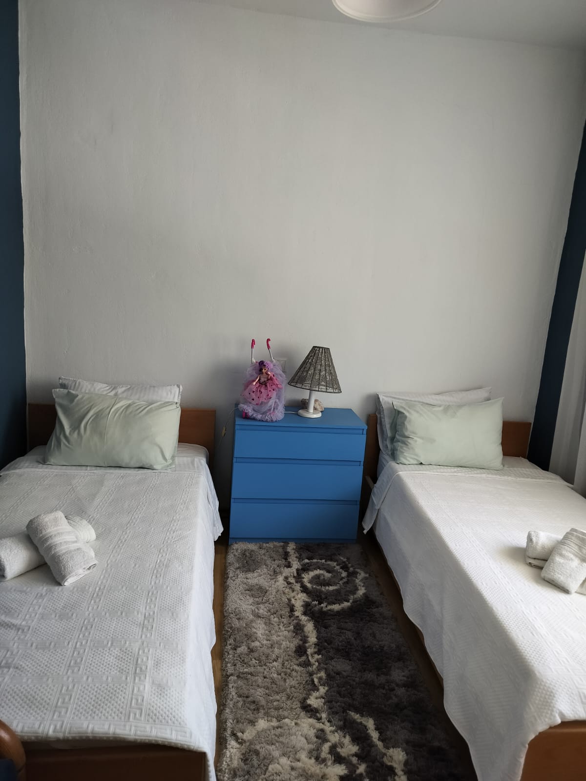 Twin bedroom with fresh linens at Porto Germeno Hotel